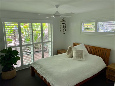 Sliding Infinity Shutters In A Bedroom